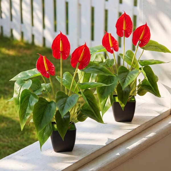 Artificial anthurium and calla lily tabletop potted arrangement
