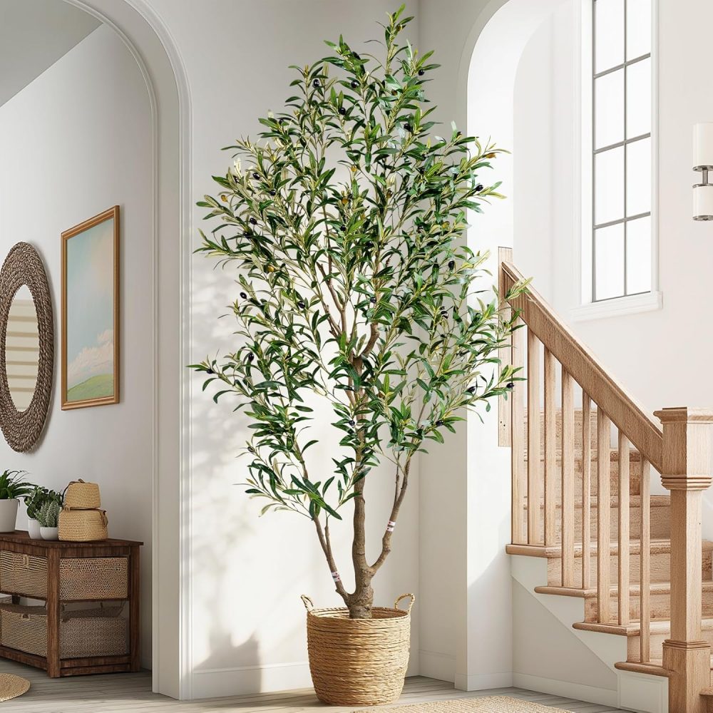 Artificial olive tree floor plant in a white planter with moss detailing; greenery for indoor and outdoor spaces